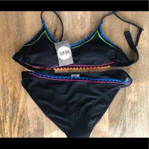 Black bikini with embroidered accents.